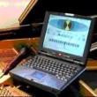 tuning a piano with a laptop
